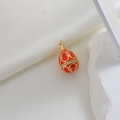 Close-up of vintage red enamel egg pendant with gold floral patterns and zircon accents - Red Heart (06)