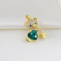 Macro shot of a golden bear pendant with a green heart crystal and micro-pave zircons - Dark Green Heart Sitting Bear Style (06)