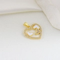 Macro shot of gold heart pendant with zircon pavé and white enamel inlay on silk - Gold Hollow Heart Style (06)