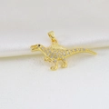 Macro view of gold dinosaur pendant with white zircon stones and black stone eye detail - Golden Dinosaur Shape Style (15)