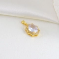 Macro detail of oval faceted zircon pendant in gold-plated frame on silk background - Oval Gemstone Pendant Style (17)