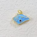 Detailed view of a gold-plated seashell pendant with blue enamel and a blue gemstone - Blue Enamel Snail (02)