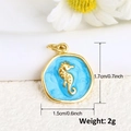 Detail of a 1.7cm seahorse pendant in 18K gold-plated copper with blue enamel - Sky Blue Round Seahorse Style (12)