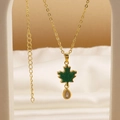 Macro view of gold chain with green enamel maple leaf and teardrop zircon pendant - Enamel Maple Leaf (05)