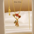 Detailed close-up of gold bear pendant with heart balloons and shiny zircons on silk - Balloon Bear (06)