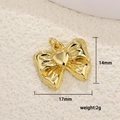 Detailed view of a gold bow pendant with heart center measuring 17mm by 14mm - Bowknot with Heart Decor (14)