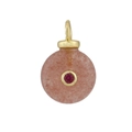 Close-up of pink natural stone pendant with a red gemstone inset in gold setting - 14 Strawberry Quartz Style
