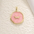 Detailed view of round pink enamel pendant with gold wings and glitter effect - Pink Wings Style (23)