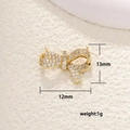 Detailed macro of gold butterfly charm with white cubic zirconia micro-pave 13mm - Bowknot Connector Pave (26)