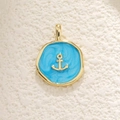 Close-up of golden anchor pendant with sky blue enamel finish for DIY jewelry - Blue Anchor Style (29)