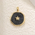 Macro shot of 18K gold plated vintage celestial star pendant with black glitter inlay - Black Starry Sky Style (30)