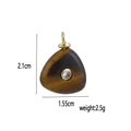 Macro detail of natural tiger eye stone pendant with size 2.1x1.55cm and crystal inlay - Tiger Eye