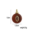 Detailed view of red agate pendant with gold eye inlay including 1.8cm size dimensions - Red Jasper