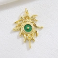 Close-up of golden Evil Eye pendant with sparkling green resin inlay and tribal details - Green Glitter Abstract Style (01)