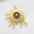 Macro detail of sunburst charm with golden rays and a tortoiseshell pattern center - Tortoiseshell Pattern Sun Style (02)