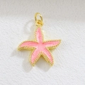 Detailed view of a golden starfish charm with pink glitter enamel and beaded edges - Pink Starfish
