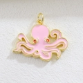 Macro shot of octopus jewelry pendant with pink enamel coating and gold-plated finish - Pink Octopus