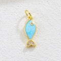 Detailed macro view of a golden fish pendant with light blue enamel and zircon stones - Light Blue Fish 2
