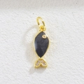 Detailed macro view of a golden fish charm with black enamel and sparkling zircon stones - Black Small Fish