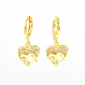 Macro view of gold heart earrings with white enamel and maternal figure relief - Madonna and Child Relief Style (02)