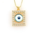 Detailed shot of 18k gold evil eye pendant with micro-inset zircons on a box chain - Deep Blue Eye (10)