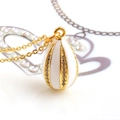 Elegant gold-plated egg pendant necklace with white enamel petals and clear zircon stones - White