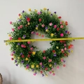 Detailed view of colorful artificial flower wreath with diameter measurement of 45cm - Large