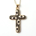 Detailed view of golden cross pendant with evil eye motif and blue stone inlay - Black White Enamel Dark Blue Gem Cross (05)