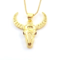 Macro shot of gold bull skull pendant with red gemstone eyes and textured horns - Red-Eyed Bull Skull (02)