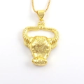 Detailed view of golden bull head pendant with intricate geometric relief patterns - Relief Texture Bull Head (03)