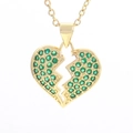 Macro shot of broken heart pendant necklace with green pave-set cubic zirconia - Emerald Green Heart Style (03)