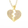 Macro shot of gold broken heart pendant with micro-pave cubic zirconia on a fine chain - Crystal White Heart Style (04)