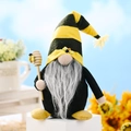 Bee-themed Christmas gnome doll with yellow striped hat and wooden honey stirrer - Male Style