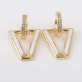 Macro view of gold V-shaped earrings with white enamel and sparkling pave zircon inlay - White