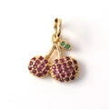 Macro detail of gold plated cherry pendant with micro inlaid red and green zircons - Cherry Shape (08)