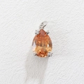 Detailed view of pear-shaped orange zircon pendant with star-shaped silver prongs - Orange Pear Style (06)