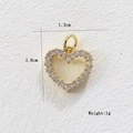 Detailed macro view of 18k gold plated heart pendant with cubic zirconia and dimensions - Heart (Gold)