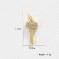Detailed macro view of 18k gold heart key pendant with dimensions 1.8cm x 0.8cm and 0.6g weight - Key (Gold)