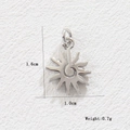 Detail view of silver sun pendant showing 1.6cm height with spiral texture and flame rays - Sun (Silver)