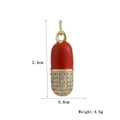 Detail of red enamel pill pendant with sparkling stones and size 2.4x0.8cm specs - Bright Red Enamel Style (01)