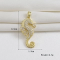 Macro shot of a 18k gold plated seahorse pendant with dimensions 3.5cm by 1.5cm - Gold Full Zircon Seahorse (06)