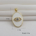 Detalle de colgante de ojo turco bañado en oro de 18k con dimensiones 3,0cm y peso 3,3g - Estilo Mal de Ojo Ovalado de Strass Azul Blanco Pavé Tono Dorado (10)