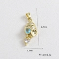 Macro detail of gold-plated heart pendant with blue zircon stones and size dimensions - Heart Gem Conch (12)