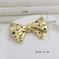 Détail du pendentif nœud plaqué or 18k avec cristaux colorés et dimensions de 4cm - Nœud Doré avec Strass Trois Couleurs (13)