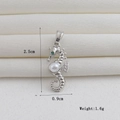 Detailed silver seahorse pendant with white pearl and green gemstone eye, size 2.5cm by 0.9cm - Silver Pearl Seahorse (15)