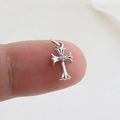 Macro shot of a small silver cross pendant with a center zircon on a fingertip - Silver Gothic Single Rhinestone (22)