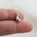 Macro shot of a tiny silver conch pendant with realistic textures for DIY jewelry making - Silver Mini Conch Style(14)