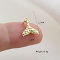 Detailed view of a 1.5cm gold whale tail pendant with a unique hammered metal texture - Gold Whale Tail Style(21)