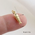 Detailed macro view of a 1.7cm golden fish charm with intricate scale textures - Gold Fish Style(31)