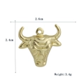 Macro shot of 18k gold bull head pendant showing 2.6cm by 2.4cm dimensions and 3.4g weight - Gold Bull Head (01)